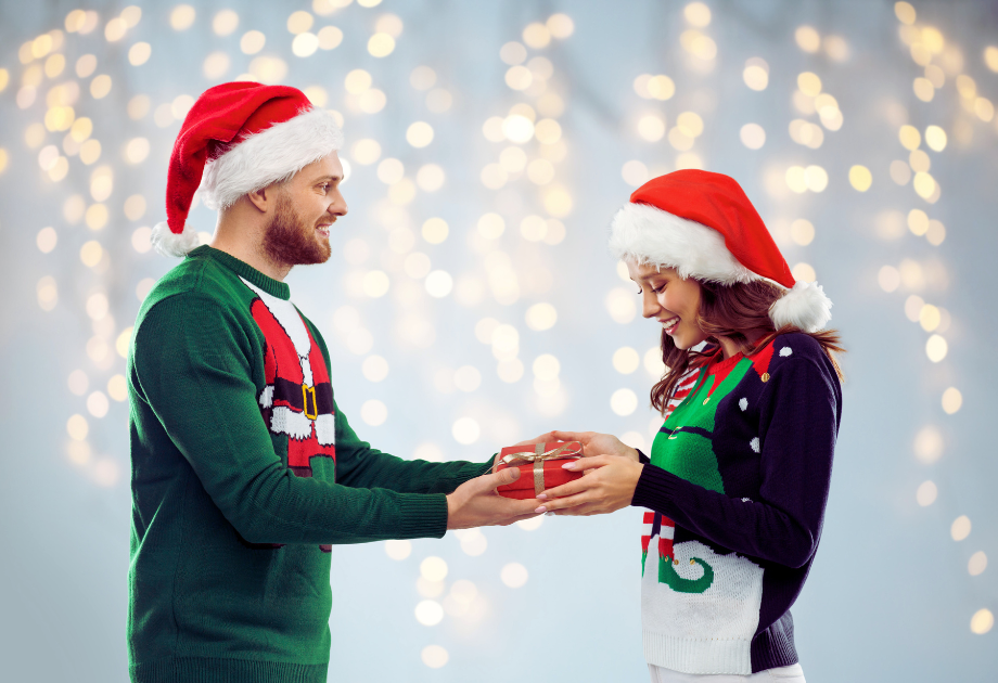 a man giving a gift to a woman